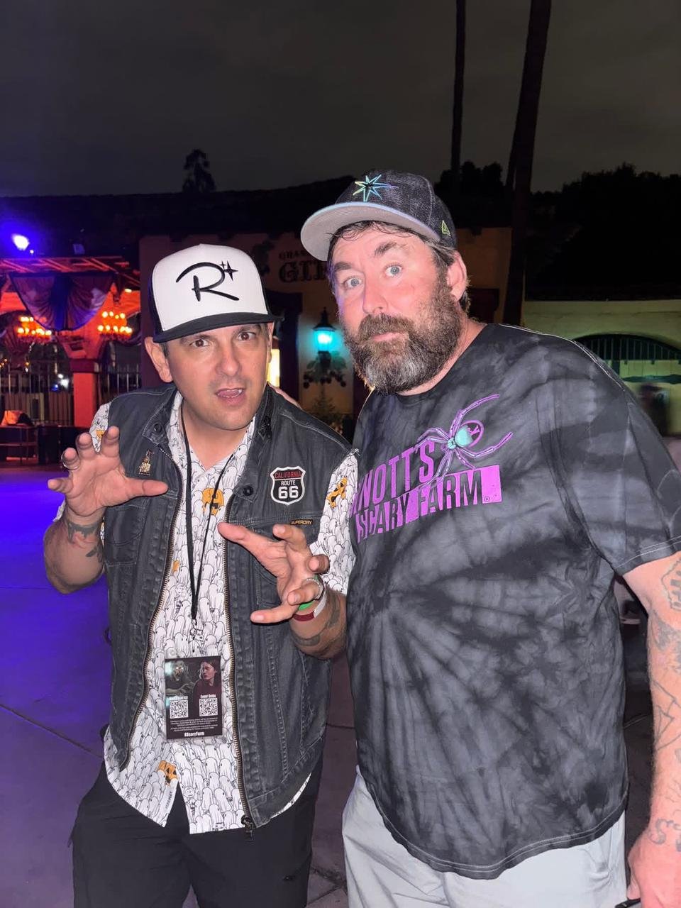 Adam the Woo smiling happily with a friend in a warm, joyful moment